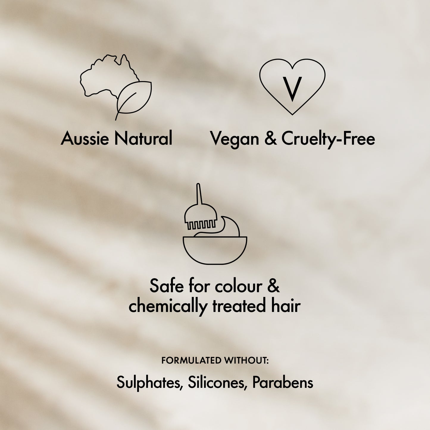 Product label with Aussie Natural, Vegan & Cruelty-Free, safe for color & chemically treated hair, and ingredient-free claims on a beige background.