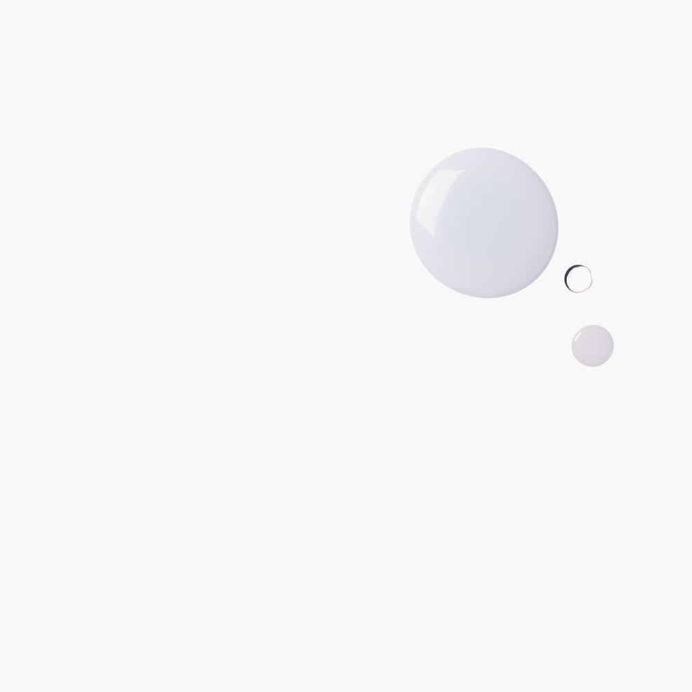 Three white spheres of different sizes on a light gray background