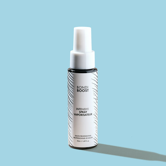 A bottle of 'Bondi Boost Mini Anti-Thinning Intensive Scalp Spray' against a light blue background.