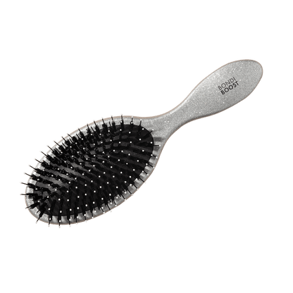 Hairbrush with 'Bouli Boost' branding on a black background