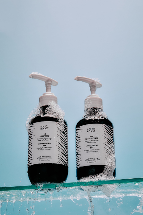 Hg Duo with pump dispensers on a light blue background.