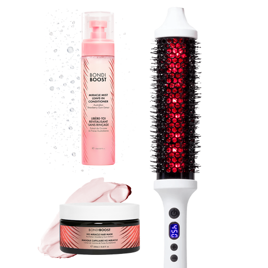 Hair care products including a bottle, mask, and hairbrush on a white background