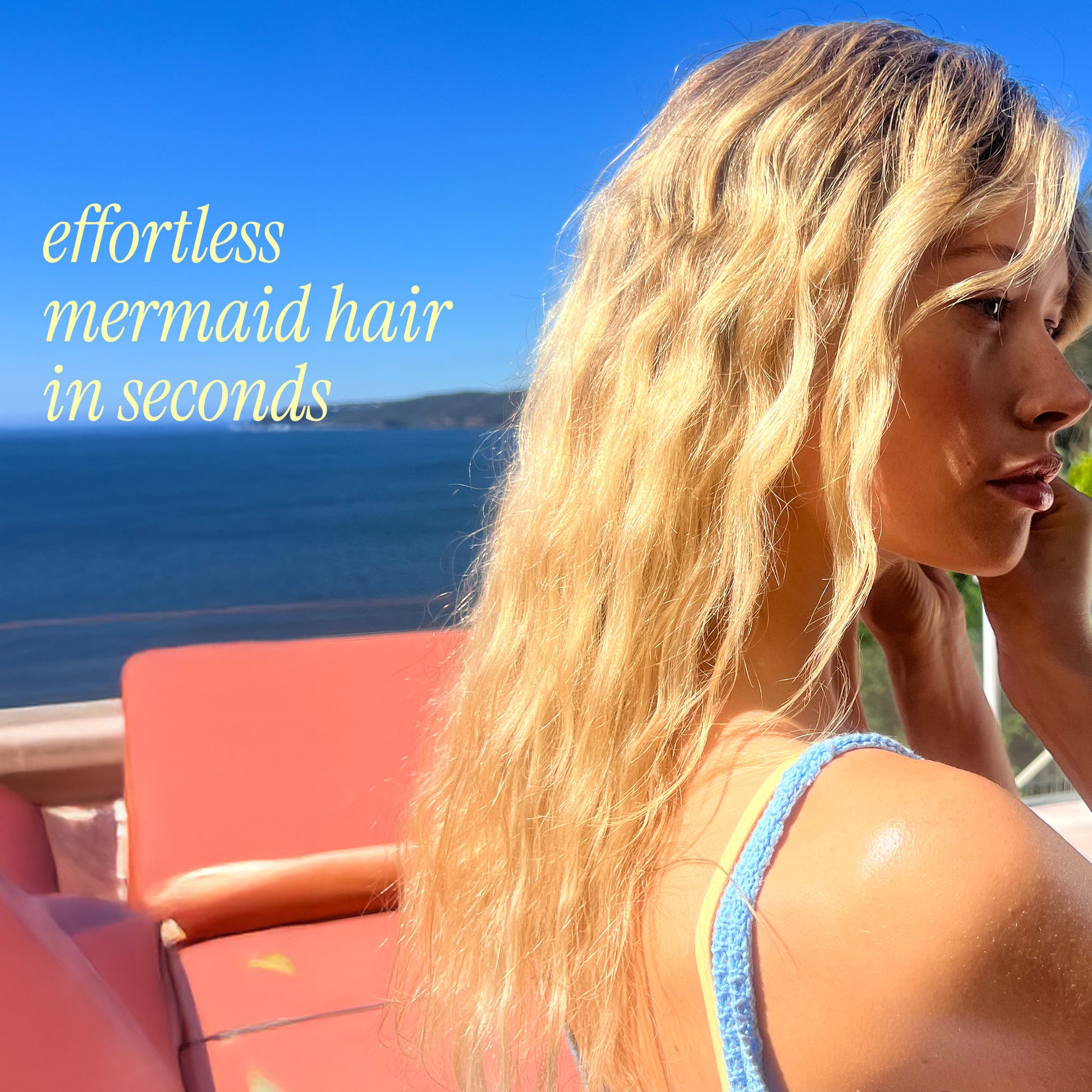Woman with mermaid-style hair by the ocean with text 'effortless mermaid hair in seconds'.